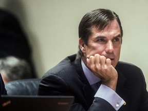 FILE - Nick Lyon, former director of the Michigan Department of Health and Human Services, is seen in Flint, Mich., Aug. 20, 2018. Lawyers for Michigan's former health director are urging an appeals court to quickly stop an effort to revive criminal charges related to the Flint water crisis of 2014-15.