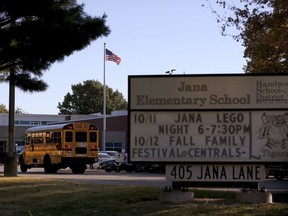 FILE - A school bus arrives at Jana Elementary School on Oct. 17, 2022, in Florissant, Mo. Another round of testing found no harmful radioactive contamination at the Missouri elementary school, leaving school board members to wonder if there really is any risk at the now-shuttered school.