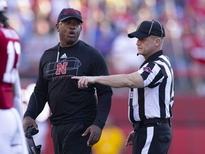Nebraska interim head coach Mickey Joseph, left, argues with a game official during the second half of an NCAA college football game against Illinois, Saturday, Oct. 29, 2022, in Lincoln, Neb. Illinois woon 26-9.