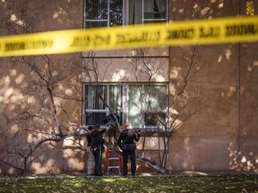 Law enforcement continue their investigation of a deadly overnight shooting at Coronado Hall on the campus of the University of New Mexico in Albuquerque, N.M., on Saturday, Nov. 19, 2022.
