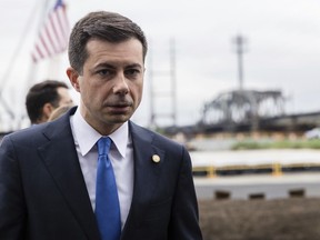 FILE -U.S. Department of Transportation Secretary Pete Buttigieg attends a groundbreaking ceremony for the New Portal North Bridge project held in Kearny, N.J., Monday, Aug 1, 2022. A group of environmental and racial justice organizations filed a lawsuit in federal court Thursday, Nov. 17, against the U.S. Department of Transportation and Buttigieg. The lawsuit aims to halt a Gulf Coast road project that the group says will harm the environment near historic Black neighborhoods.