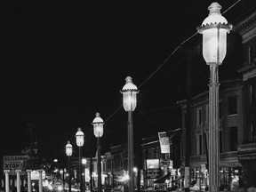 FILE - Gas lamps illuminate St. Louis' Gaslight Square on April 2, 1962. "Gaslighting" -- mind manipulating, grossly misleading, downright deceitful -- is Merriam-Webster's word of 2022.
