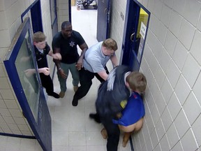 In this screenshot taken from Camden County Detention Center surveillance video provided by attorney Harry Daniels, jailers beat detainee Jarrett Hobbs at the facility, in Georgia, on Sept. 3, 2022. (Camden County Detention Center/Courtesy of Attorney Harry Daniels via AP)
