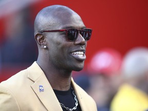 FILE - Former NFL wide receiver Terrell Owens is shown before an NFL football game between the San Francisco 49ers and the Oakland Raiders in Santa Clara, Calif., on Nov. 1, 2018. Owens said a fight caught on camera in which he punched a man in a CVS parking lot was the result of an "aggressor" threatening him and a fan he was talking to at the California store on Saturday, Nov. 26, 2022.