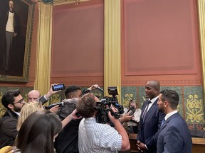 State Rep. Joe Tate, right, talks with reporters after Michigan House Democrats voted to make him the first Black speaker in state history on Thursday, Nov. 10, 2022, in Lansing, Mich.