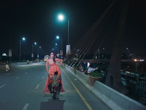 This image released by all caps/Khoosat Films shows a scene from the film "Joyland." A Pakistani official says the country's Oscar entry, "Joyland," is banned from cinemas, despite being previously approved for release. The movie features a love story between a married man and a transgender woman and caused controversy in the Muslim-majority country even before it hit the big screen. (all caps/Khoosat Films via AP)