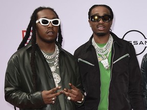 FILE - Takeoff, left, and Quavo of Migos, arrive at the BET Awards in Los Angeles on June 27, 2021. Houston police say one person was fatally shot and two others injured early Tuesday at a private party attended by members of the rap group Migos.