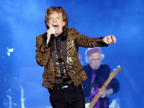 FILE - Mick Jagger, of the Rolling Stones, performs during the band's "No Filter" tour on Monday, Nov. 15, 2021, at Ford Field in Detroit. The Rolling Stones plan to release what they're calling their "ultimate live greatest hits album," with appearances by Lady Gaga, Bruce Springsteen, Gary Clark Jr. and The Black Keys, early next year."GRRR Live!" contains songs recorded live on Dec. 15, 2012, at Newark, New Jersey's Prudential Center.