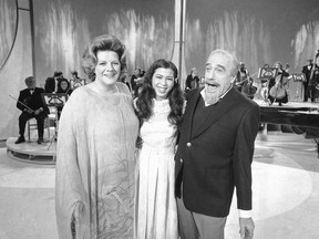 FILE - Conductor Mitch Miller performs for photographers with singers Rosemary Clooney, left, and Irene Cara, center, during a rehearsal, on Jan. 6, 1981, in New York for his NBC-TV special called "The Mitch Miller Show: A Sing Along Sampler." Oscar, Golden Globe and two-time Grammy winning singer-actress Cara, who starred and sang the title cut from the 1980 hit movie "Fame" and then belted out the era-defining hit "Flashdance ... What a Feeling" from 1983's "Flashdance," has died at age 63. Her publicist Judith A. Moose confirmed the death on Saturday, Nov. 26, 2022.