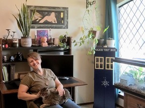 This photo provided by Rebecca Thompson shows Rebecca Thompson, in her office at her parent's house, plans to buy a home with help from her employer, Dallas Area Habitat for Humanity. (Rebecca Thompson via AP)