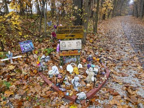 FILE - A makeshift memorial to Liberty German and Abigail Williams is pictured near where they were last seen and where the bodies were discovered along the Monon Trail leading to the Monon High Bridge Trail in Delphi, Ind., Oct. 31, 2022. Documents related to a man's arrest in the 2017 killings of two teenage girls were unsealed Tuesday, Nov. 29, 2022 by an Indiana judge, allowing for the first public disclosure of evidence authorities have against the suspect since he was arrested last month.