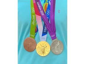 This photo provided by the Orange County Sheriff's Department in California shows three Olympic Games medals stolen during the course of a home burglary in Laguna Hills, Calif. On Thursday, Nov. 10, 2022, authorities said they were seeking the public's help and are looking for the medals belonging to a member of the U.S. women's volleyball team. (Courtesy of Orange County Sheriff's Department via AP)