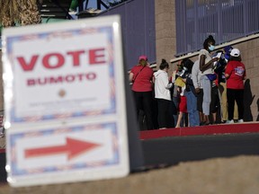 FILE - People wait in line to vote at a polling place on Election Day, Nov. 3, 2020, in Las Vegas. Ballots will be counted after the poll close Tuesday, Nov. 8, 2022, despite the efforts of candidates loyal to former President Donald Trump to spread doubt about the outcome of the 2020 election and these 2022 midterms. The Associated Press collects all the vote data and declares the winners. It also outlines how the voting process work in a series of explanatory stories you can explore here.