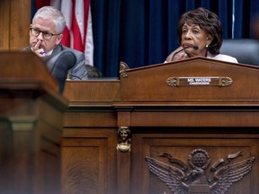 FILE - Chairwoman Maxine Waters, D-Calif., right, and Ranking Member Patrick McHenry, R-N.C., left, listen to testimony from banking leaders as they appear before a House Committee on Financial Services Committee hearing on Capitol Hill in Washington, Sept. 21, 2022. Lawmakers plan to investigate the failure of FTX, the large crypto exchange that collapsed last week and filed for bankruptcy protection, leaving investors and customers staring at losses that could total in the billions of dollars.