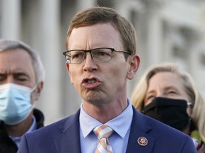 FILE - U.S. Rep. Dusty Johnson, R-S.D., speaks during a news conference on Dec. 21, 2020, on Capitol Hill in Washington. Republicans will hold a House majority for the first time since Johnson entered Congress in 2018, yet that is unlikely to change the South Dakota Republican's political style of focusing on conservative policy over hot takes on cable news or Twitter, he told the Associated Press on Thursday, Nov. 17, 2022.
