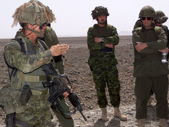 Inquiry members and special advisers at the Tarnac Farm training area south of Kandahar airfield where four soldiers died and eight others were injured on April 17, 2002. - Master Cpl. Danielle Bernier / DND