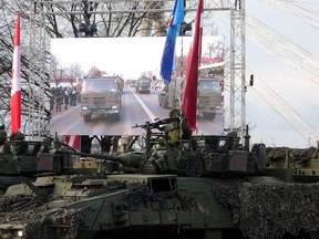 Latvian Army armoured personnel carriers shown during a military parade on Latvian Independence Day, in Riga, Friday, Nov. 18, 2022.