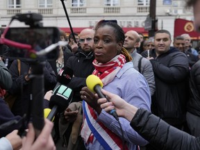 Far-left parliament member Rachel Keke attends a rally to support Black lawmaker, Carlos Martens Bilongo, Friday, Nov. 4, 2022 outside the National Assembly in Paris. Carlos Martens Bilongo said Friday he was "deeply hurt" after a far-right member of the French parliament made a racist remark during a legislative session, something that has triggered condemnations from across the political spectrum.