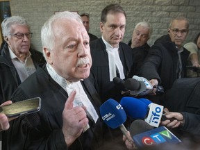 Defence lawer Gary Martin, left, representing Yuesheng Wang, and Crown Prosecutor Marc Cigana speak to the media after a hearing at the courthouse in Longueuil, Quebec Tuesday, November 15, 2022.&ampnbsp;A former employee of Quebec's power utility charged with spying on behalf of China has been freed on bail while he awaits trial.