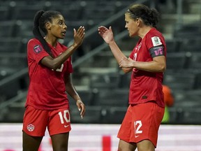Canada's Christine Sinclair, left, is congratulated by teammate Ashley Lawrence after scoring her side's opening goal against Trinidad and Tobago during a CONCACAF Women's Championship soccer match in Monterrey, Mexico, Tuesday, July 5, 2022. Seventh-ranked Canada renews its rivalry with No. 9 Brazil on Friday in the first of two women's soccer friendlies. Captain Sinclair and Lawrence are back after missing October friendlies against Argentina and Morocco.