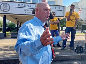 Stacy George, a former officer at Limestone Correctional Facility, speaks to reporters outside the Alabama Department of Corrections headquarters in Montgomery, Ala., Friday, Nov. 4, 2022. George, who recently resigned from the department, said Alabama is no longer in control of prisons because of overcrowding and low staffing.