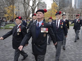 Canadian veterans march after Remembrance Day ceremonies, Friday, November 11, 2022 in Montreal. Case managers at Veterans Affairs Canada are warning that lives could be at stake as the government presses ahead with plans to change the way rehabilitation services are provided to ill and injured ex-soldiers.THE CANADIAN PRESS/Ryan Remiorz