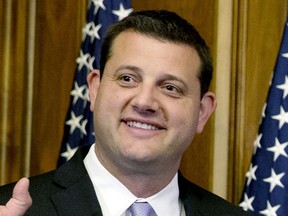 FILE - U.S. Rep. David Valadao, R-Calif., poses during a ceremonial re-enactment of his swearing-in ceremony in the Rayburn Room on Capitol Hill in Washington on Jan. 6, 2015. Valadao has defeated Democrat Rudy Salas in a Central Valley district, overcoming a strong Democratic registration advantage and fallout from his vote to impeach then-President Donald Trump.