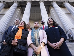 Community leaders Frank Baylis, Rev. Diane Rollert, unknown, Harginder Kaur, Stephen Brown and Laura Berger, let to right, stand outside the Court of Appeal on the first day of hearings on the appeal of Bill 21 in Montreal, on Monday, November 7, 2022.