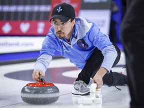 FILE - Quebec suffered its first defeat at the 2022 Canadian mixed curling championship in surprising fashion, dropping an 8-0 decision to previously winless Yukon in Wednesday's early draw. Team Quebec's Felix Asselin makes a shot at the Tim Hortons Brier in Lethbridge, Alta., on March 6, 2022.