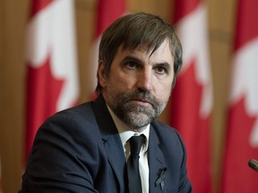 Minister of Environment and Climate Change Steven Guilbeault is seen during a news conference in Ottawa, Thursday, Sept. 15, 2022. Guilbeault says Canada's promised emissions cap on the oil and gas sector won't be finalized for another year.THE CANADIAN PRESS/Adrian Wyld