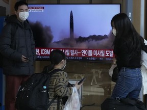 A TV screen shows a file image of North Korea's missile launch during a news program at the Seoul Railway Station in Seoul, South Korea, Friday, Nov. 18, 2022. South Korea says the missile North Korea launched Friday morning is likely an intercontinental ballistic missile.
