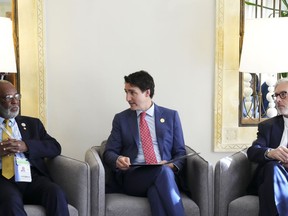 Foreign Minister of Haiti Jean Victor Geneus, Prime Minister Justin Trudeau and OIF Deputy Secretary General Geoffrey Montpetit takes part in a discussion regarding the situation in Haiti on the side-lines of the Francophonie Summit in Djerba, Tunisia on Sunday, Nov. 20, 2022.