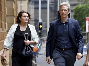 Professor Mette Nyegaard, left, and Professor Michael Toft Overgaard return from a break for the second inquiry into Kathleen Folbigg's convictions for killing four of her children in Sydney, Australia, Tuesday, Nov. 15, 2022. The two genetic experts have told an inquiry that a rare genetic variant likely caused the deaths of two daughters of an Australian convicted child killer.