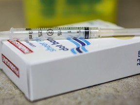 A needle and syringe used to administer a flu shot in shown in Virgil, Ont., Monday, October 5, 2020.&ampnbsp;Free flu shots are now available for anyone in Ontario aged six months and older.&ampnbsp;THE CANADIAN PRESS/Tara Walton