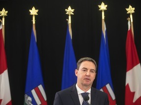 Alberta's Health Minister Jason Copping gives an update in Edmonton, Tuesday, Sept. 21, 2021. Copping says he is not pursuing user-pay changes to the publicly funded system, but the Opposition NDP says Premier Danielle Smith needs to be clear on that.