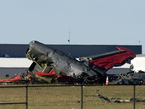 Debris from two planes that crashed during an airshow at Dallas Executive Airport are shown in Dallas on Saturday, Nov. 12, 2022.