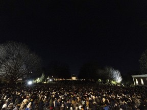 Students participate in a vigil in response to shootings that happened on the University of Virginia campus the night before in Charlottesville, Va., on Monday, Nov. 14, 2022.