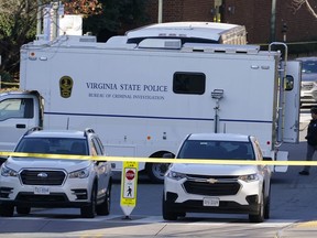 A Virginia State Police crime scene investigation truck is on the scene of an overnight shooting at the University of Virginia, Monday, Nov. 14, 2022, in Charlottesville. Va.
