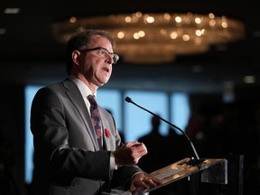 B.C. Health Minister Adrian Dix responds to questions during a news conference with his provincial counterparts after the first of two days of meetings, in Vancouver, on Monday, November 7, 2022.