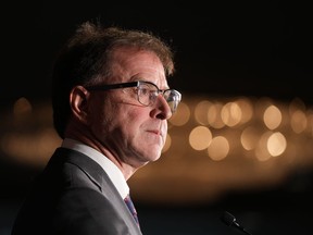 B.C. Health Minister Adrian Dix pauses while responding to questions during a news conference, in Vancouver, on Monday, November 7, 2022. Dix says the government has plans to cancel surgeries at British Columbia hospitals to make room for patients with respiratory illnesses, but it has not yet reached that point.THE CANADIAN PRESS/Darryl Dyck