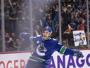 Vancouver Canucks' Andrei Kuzmenko (96) celebrates his third goal against the Anaheim Ducks during the third period of an NHL hockey game in Vancouver on Thursday, November 3, 2022.