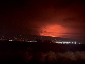 A general view of Hawaii's Mauna Loa volcano, in Kailua-Kona, Hawaii, U.S., November 28, 2022 in this screen grab taken from a social media video.