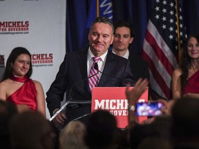 Wisconsin Republican gubernatorial candidate Tim Michels makes his way to the podium to address his supporters at the Italian Community Center early Wednesday, Nov. 9, 2022, in Milwaukee.