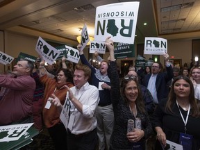Supporters cheers as Sen. Ron Johnson, R-Wis., speaks to his supporters in the early morning hours at an election night party in Neenah, Wis., Wednesday, Nov. 9, 2022.