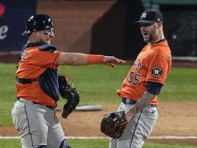 Houston Astros relief pitcher Ryan Pressly and catcher Christian Vazquez celebrate the Astros' win in Game 4 of baseball's World Series between the Houston Astros and the Philadelphia Phillies on Wednesday, Nov. 2, 2022, in Philadelphia. The Astros won 5-0 with a combined no-hitter to tie the series two games all.