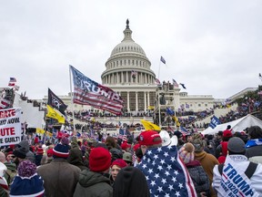 FILE - Rioters loyal to President Donald Trump rally at the U.S. Capitol in Washington on Jan. 6, 2021. .
