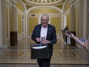 FILE - Senate Majority Leader Chuck Schumer, D-N.Y., returns to the Capitol in Washington, on the morning after Election Day Nov. 9, 2022.