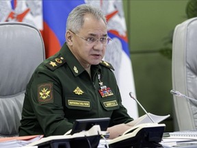 In this handout photo taken from video released by Russian Defense Ministry Press Service on Tuesday, Nov. 1, 2022, Russian Defense Minister Sergei Shoigu attends a meeting with hight level military officials in Moscow, Russia. Shoigu said Tuesday that a total of 300,000 men have been drafted in the partial call-up announced by Putin on Sept. 21, and 87,000 of them have been deployed to Ukraine. (Russian Defense Ministry Press Service via AP)