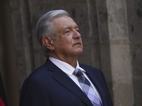 FILE - Mexican President Andres Lopez Obrador stands at the National Palace during a welcome ceremony for Germany's President Frank-Walter Steinmeier in Mexico City,, Sept. 20, 2022. López Obrador said Friday, Oct. 7 he has chosen the head of the country's tax agency to fill the cabinet-level post of secretary of the economy.