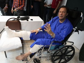 Former Pakistani Prime Minister Imran Khan speaks during a news conference in Shaukat Khanum hospital, where is being treated for a gunshot wound in Lahore, Pakistan, Friday, Nov. 4, 2022. Khan's protest march and rallies were peaceful until the afternoon attack on Thursday, when a gunman opened fire at his campaign truck. The shooting has raised concerns about growing political instability in Pakistan, a country with a history of political violence and assassinations.